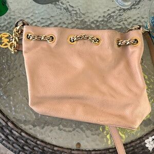 I have a Michael Kors purse, pink, and good shape